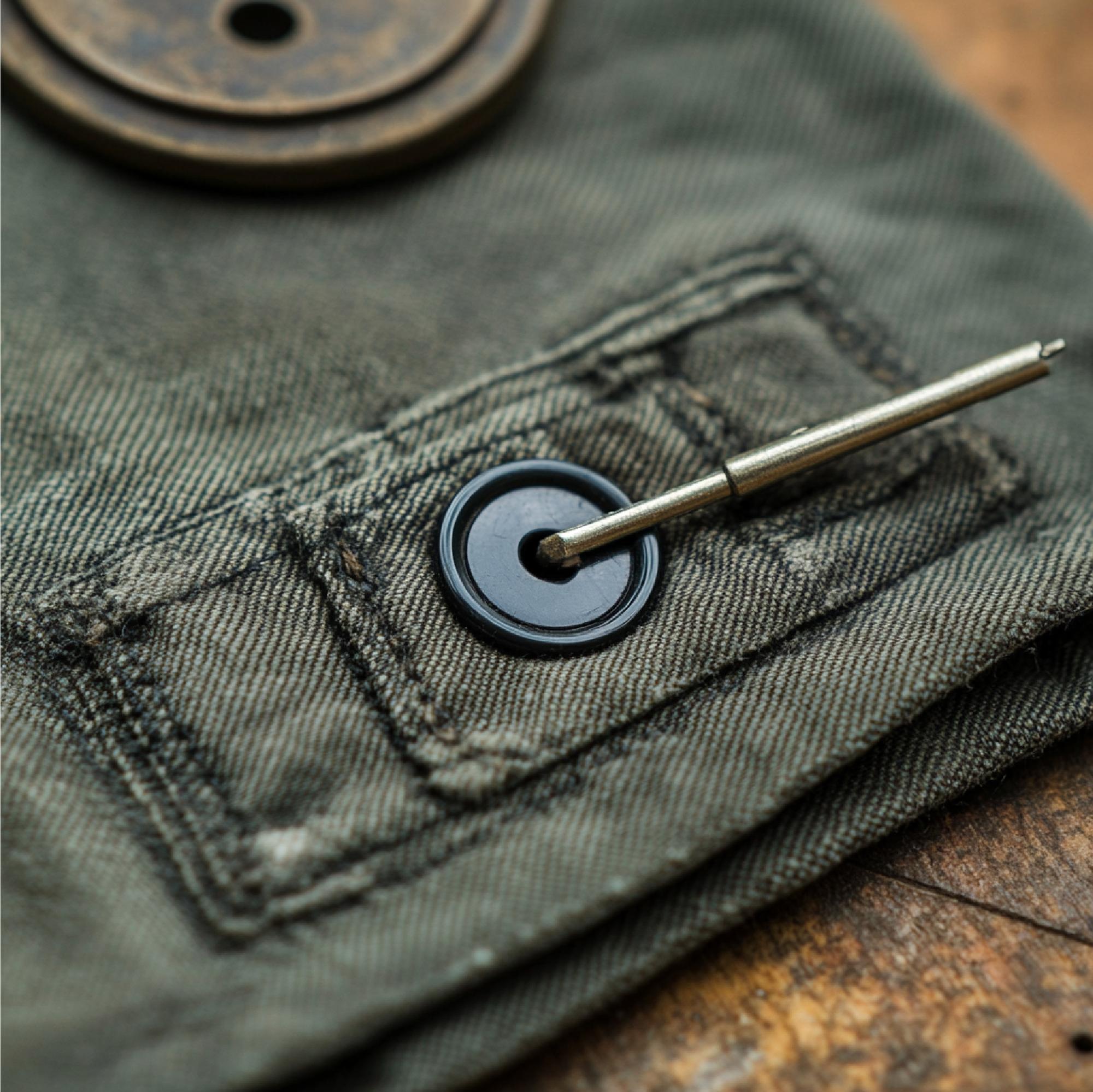 Embroidered brand patch on denim